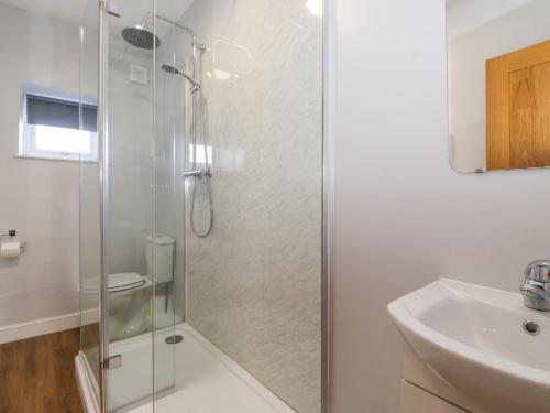 a bathroom with a shower and a sink at 2 South Street in Wigton