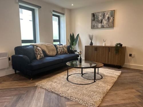 a living room with a couch and a coffee table at Museum View Apartments City Centre 1 Bedroom in Cardiff