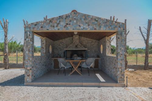 a tent with a table and chairs in it at Luxury Beach Villa in Skála