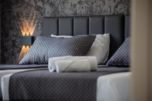 a bedroom with a bed with two pillows at BRAND NEW! Villa Adriatic Bay2 with a private pool in Novalja