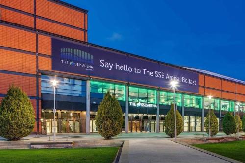 a building with a sign that says say hello to the see main building at Darcy's Stopover NITB Approved in Belfast