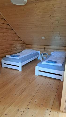 Postel nebo postele na pokoji v ubytování "Prawie nad morzem"