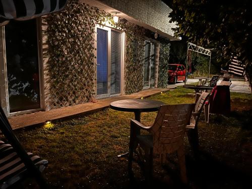 a table and chairs in front of a building at Yahya Rooms in Ohrid