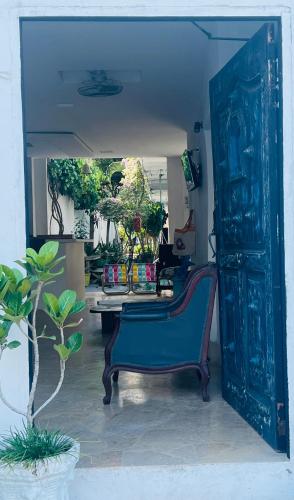 an open door with a bench in a room at Casa Torices Real 12 in Cartagena de Indias
