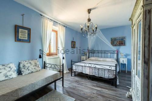 A bed or beds in a room at Podere Umbro