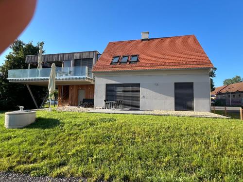a house with a green yard with a house at Paradies in Bad Radkersburg