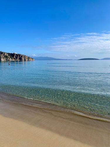 a view of the ocean with a sandy beach at Panoramic Villa in Tolo
