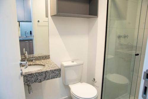 a bathroom with a toilet and a sink and a shower at ST Studios Vila Mariana by Housi in Sao Paulo