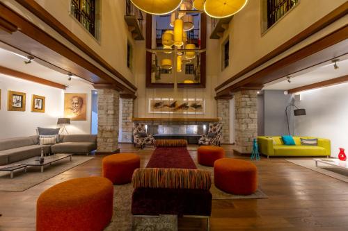 a living room with a couch and a fireplace at 1850 Hotel Boutique in Guanajuato