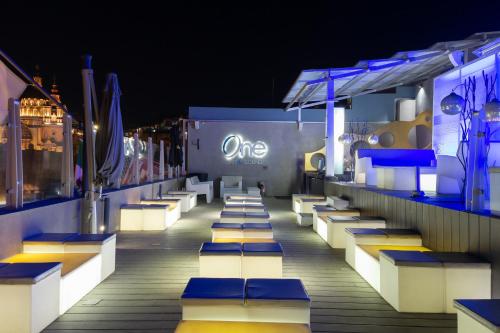 a deck on a cruise ship at night at 1850 Hotel Boutique in Guanajuato