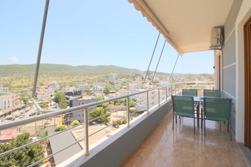 a balcony with a table and chairs and a view at Hotel Milo Ksamil in Ksamil