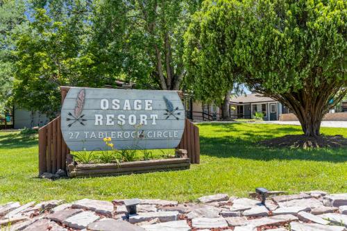 a sign for the oasis resort halsted circle at Osage Resort in Branson
