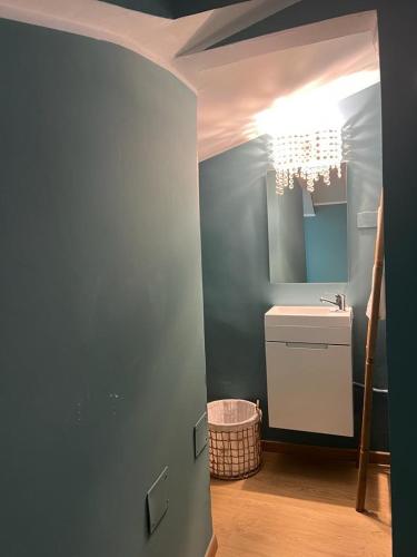 a bathroom with a sink and a mirror at La terrazzina OLTRE HOME HOLIDAYS in Sanremo