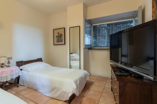 Ένα ή περισσότερα κρεβάτια σε δωμάτιο στο Villa Ca' Vecchia