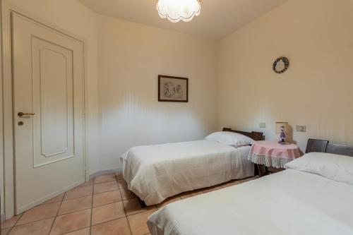 Ένα ή περισσότερα κρεβάτια σε δωμάτιο στο Villa Ca' Vecchia