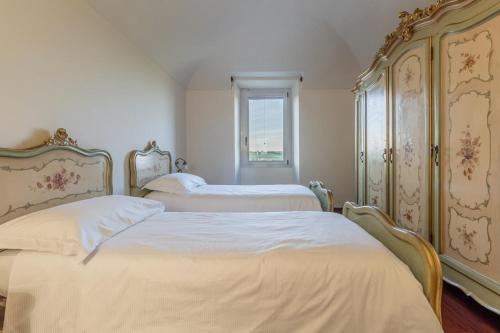 Ένα ή περισσότερα κρεβάτια σε δωμάτιο στο Villa Ca' Vecchia