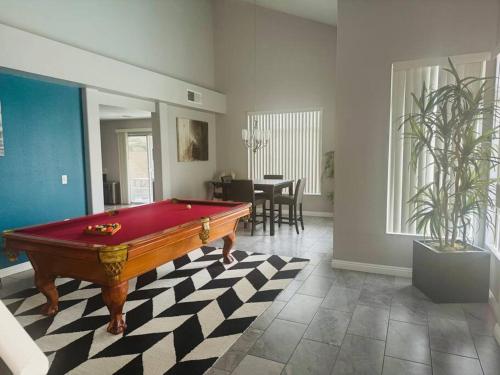 a living room with a pool table in it at Paradise in Las Vegas