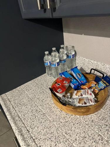 a bowl of food and water bottles on a counter at Paradise in Las Vegas