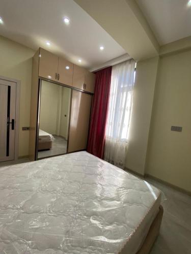 a bedroom with a large bed in a room at Buzovna Delmar Luxury Residence in Mardakan