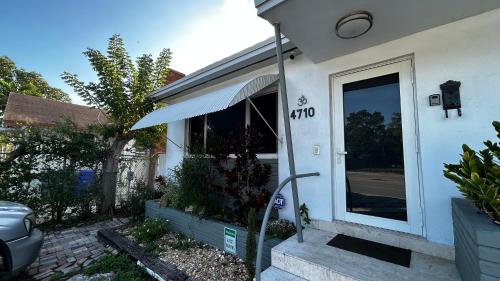 a house with a hose coming out of the door at Llano Atelier in Miami