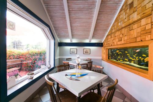 a dining room with a table and a window at Gościniec pod Żaglami in Skoki Duże