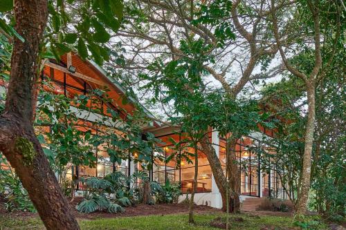 a large building with trees in front of it at Igwara Lodge in Kamdini