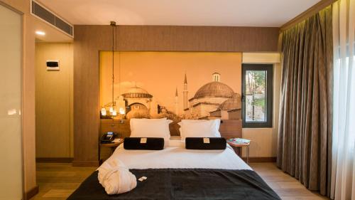 a bedroom with a large white bed in a room at Hotel Saint Sophia in Istanbul