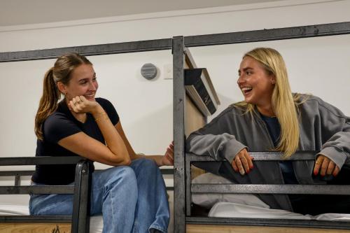 two women are laughing in a room at Nomads Sydney in Sydney