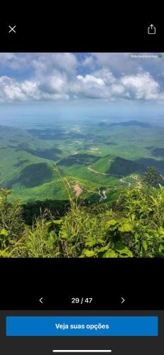 a screenshot of a view of a valley with a plane at Complexo Turístico Gruta da Serra in Guaramiranga