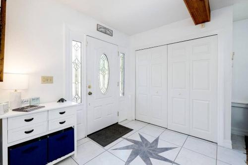 a white bathroom with a star on the floor at Pool - Beach Supplies - Outdoor Shower - PingPong Table in Bradenton
