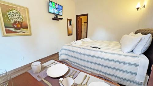 Cama o camas de una habitación en Pousada Medeiros