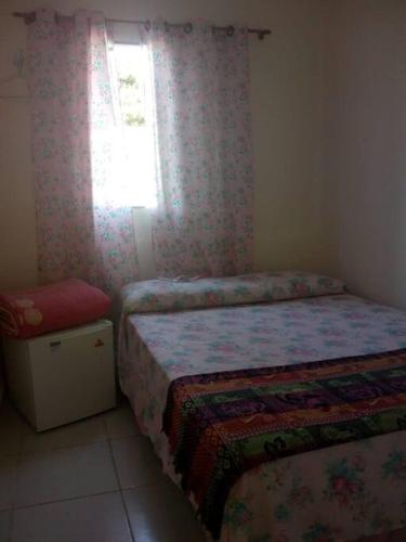 Una cama o camas en una habitación de POUSADINHA Enseada