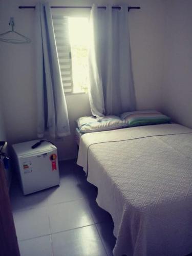 Una cama o camas en una habitación de POUSADINHA Enseada