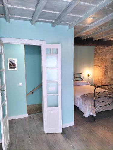 Ένα ή περισσότερα κρεβάτια σε δωμάτιο στο Casa Carradas