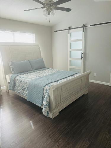 a bedroom with a bed and a ceiling fan at Paradise in Las Vegas