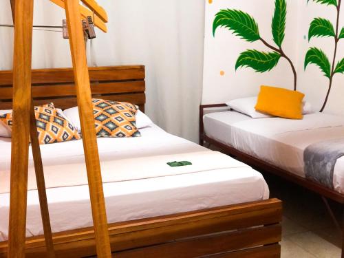 Postel nebo postele na pokoji v ubytování Hostal Síndigo