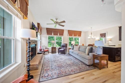 a living room with a couch and a fireplace at Private, Gatlinburg Bliss with Hot Tub and City Views in Gatlinburg