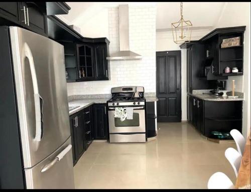 Kuchyň nebo kuchyňský kout v ubytování Moderno Y Elegante apartamento con piscina