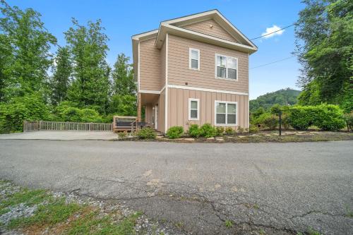 a house on a street with a driveway at Private, Gatlinburg Bliss with Hot Tub and City Views in Gatlinburg