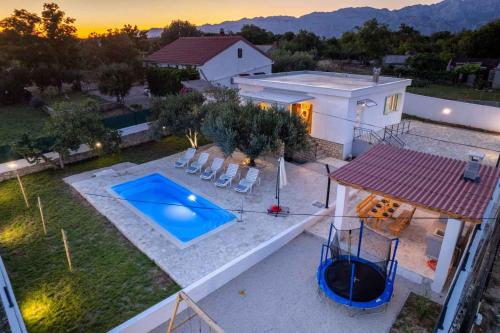 an overhead view of a house with a swimming pool at Holiday home in Slivnica - Paklenica Riviera 44875 in Slivnica