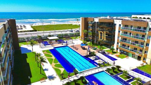 an aerial view of a resort with a swimming pool at Vg Fun by Diego Flats in Fortaleza