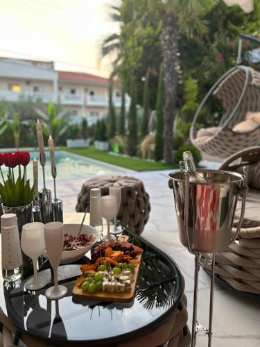 a table with a tray of food and a plate of food at villa MeDITeRAN in Pefkohori
