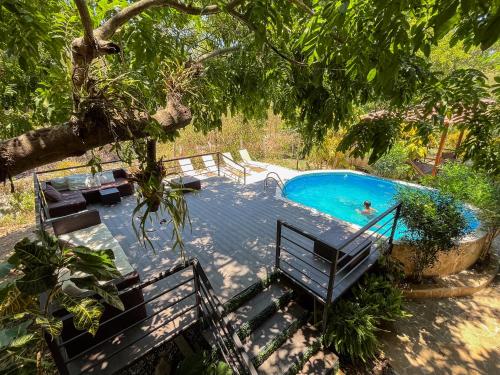 a pool with a person swimming in it at Donde Chalo in Paquera