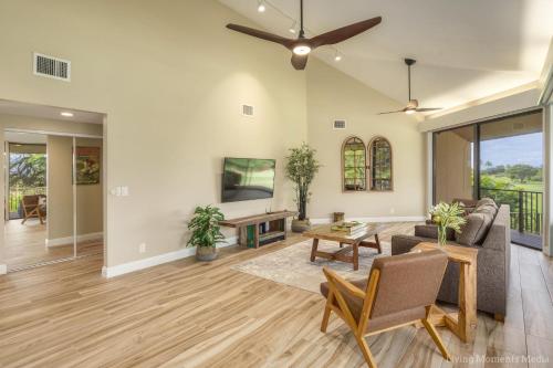 a living room with a ceiling fan at Kaanapali Hini NEW POOL - FULLY REMODELED - Across the Street From Kaanapali Beach in Lahaina