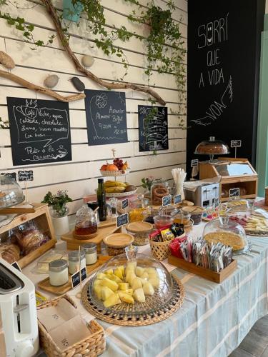 a table with a buffet of food on it at Cabañas de Lires in Lires