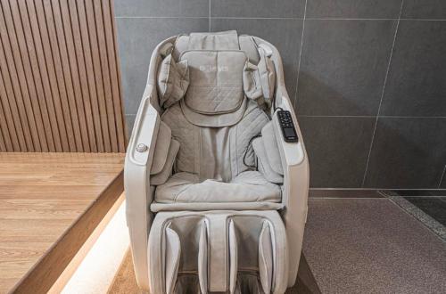 a baby car seat sitting in the corner of a room at Brown Dot Hotel Andong Ok-dong in Andong