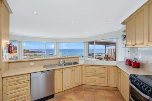 a kitchen with a view of the ocean at 3 Dickinson Avenue in Bermagui