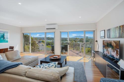a living room with a couch and a table at Seascape 3-7 in Bermagui