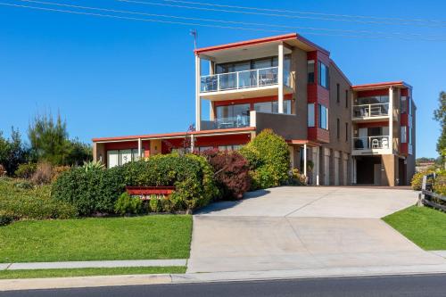 an apartment building with a driveway in front of it at 4-66 Lamont st in Bermagui
