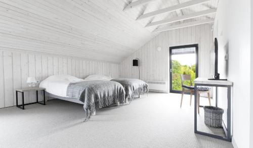 Un pat sau paturi într-o cameră la Kalaranna Holiday Home
